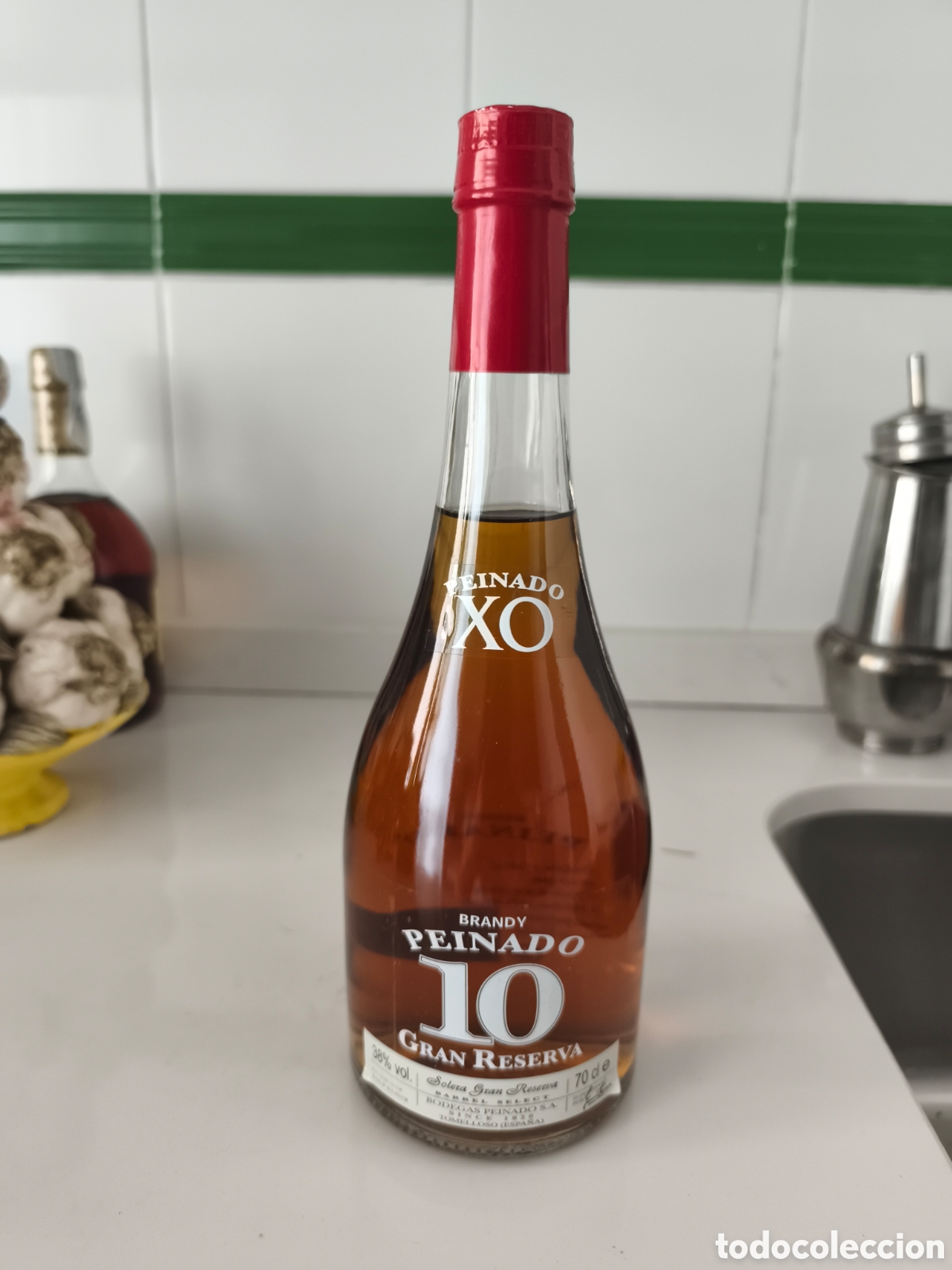 Coleccionismo de vinos y licores: Antigua botella de Brandy Peinado 10 a&ntilde;os Gran reserva.llenaby cerrada