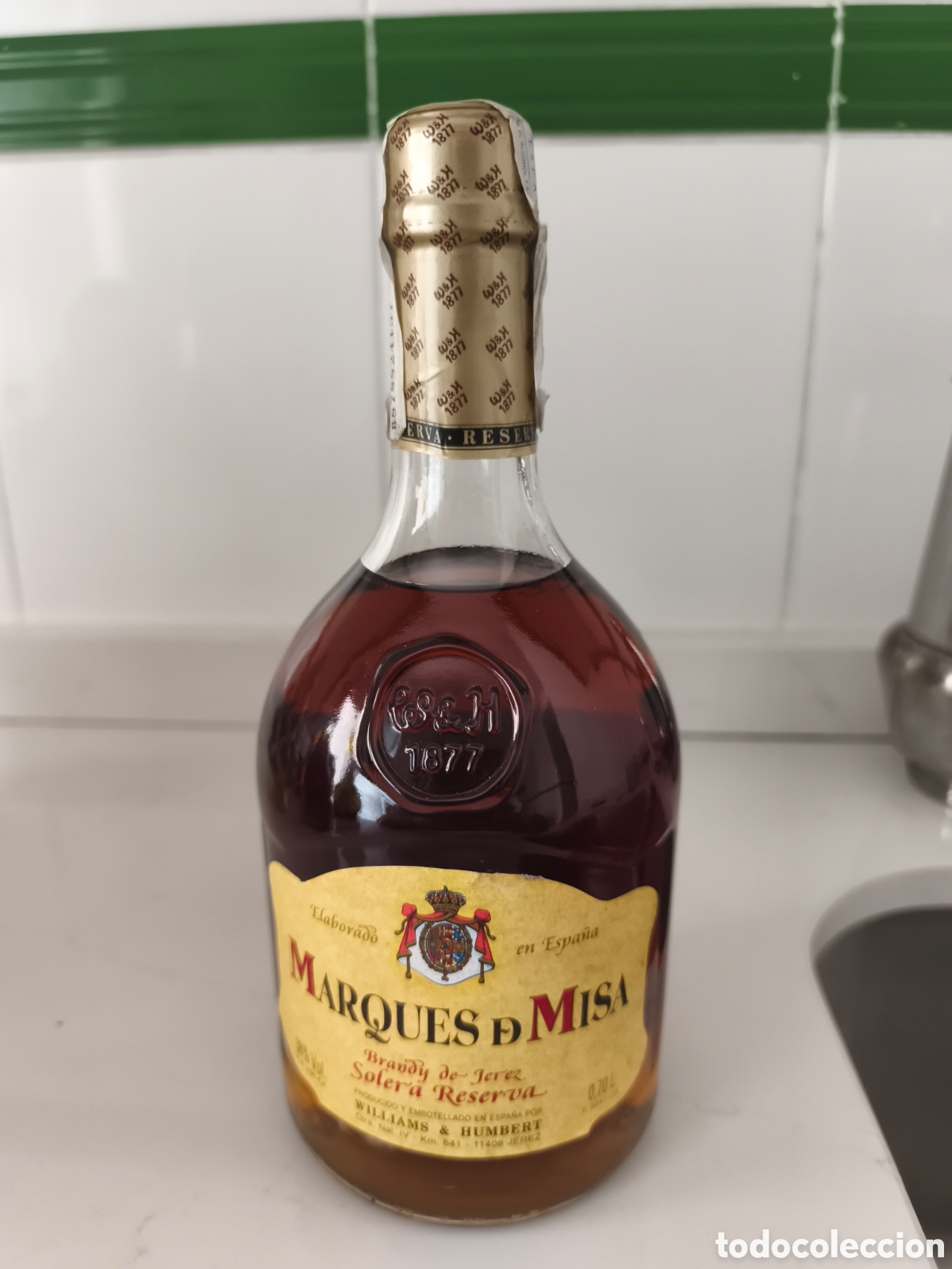 Coleccionismo de vinos y licores: Antigua botella de Brandy solera reserva Marques de Misa Llena y cerrada