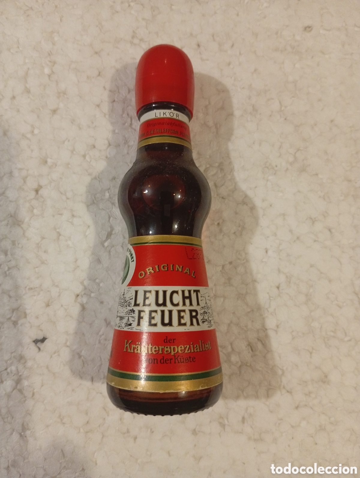 Coleccionismo de vinos y licores: BOTELL&Iacute;N LEUCHT FEUER. KR&Auml;UTER DER K&Uuml;STE. 4 CL
