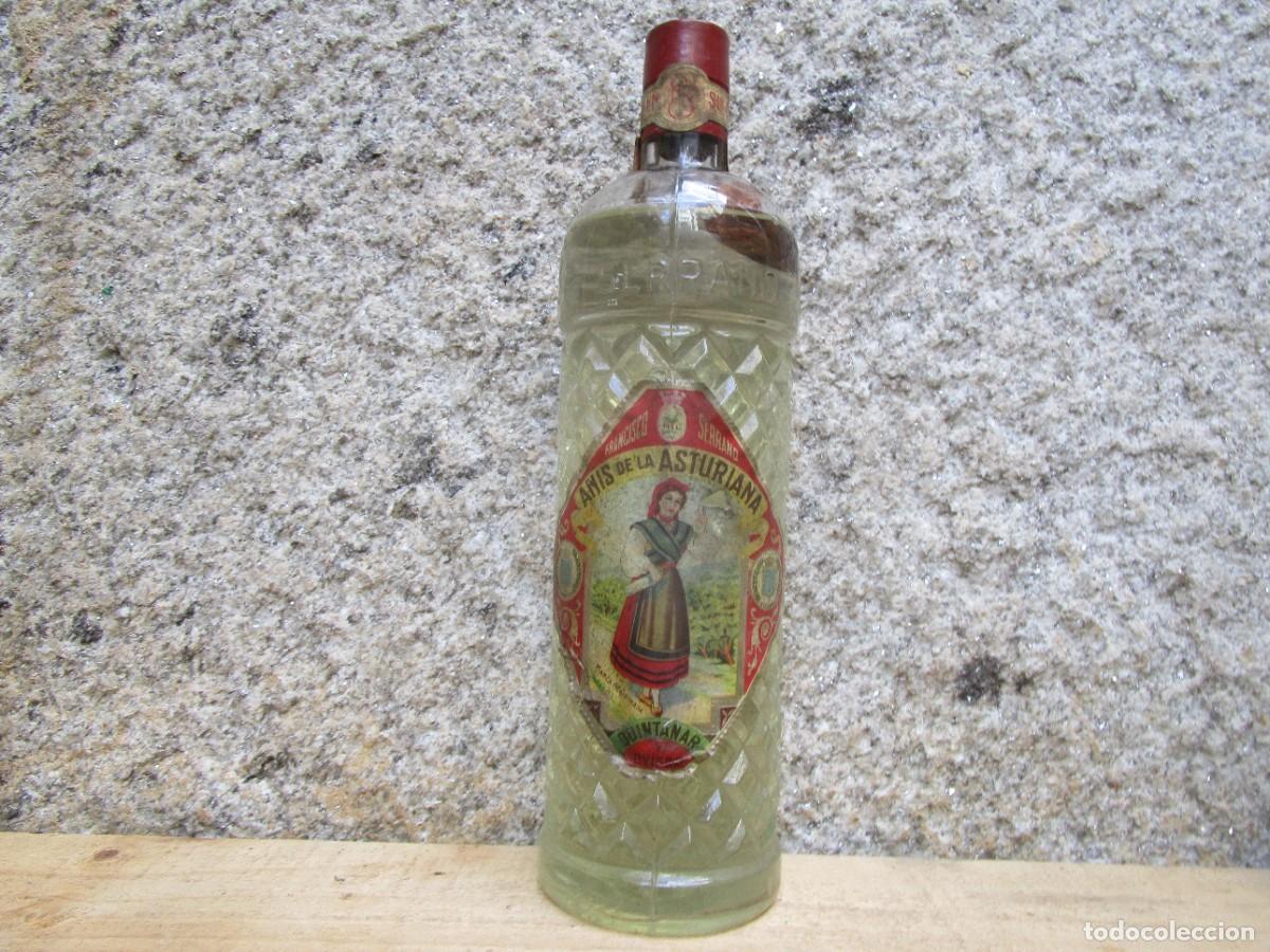 Coleccionismo de vinos y licores: ANIS DE LA ASTURIANA FRANCISCO SERRANO - QUINTANAR Y OVIEDO, BOTELLA LITRO, LEVE MERMA CAPSULA PLOMO