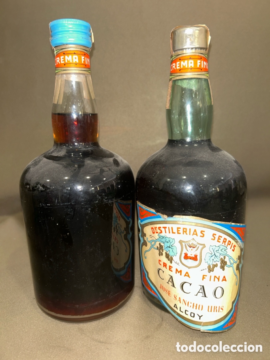 Coleccionismo de vinos y licores: LOTE DE 2 BOTELLAS DESTILER&Iacute;AS SERPIS CREMA FINA CACAO JOSE SANCHO URIS ALCOY *PRECINTADA, LLENA*