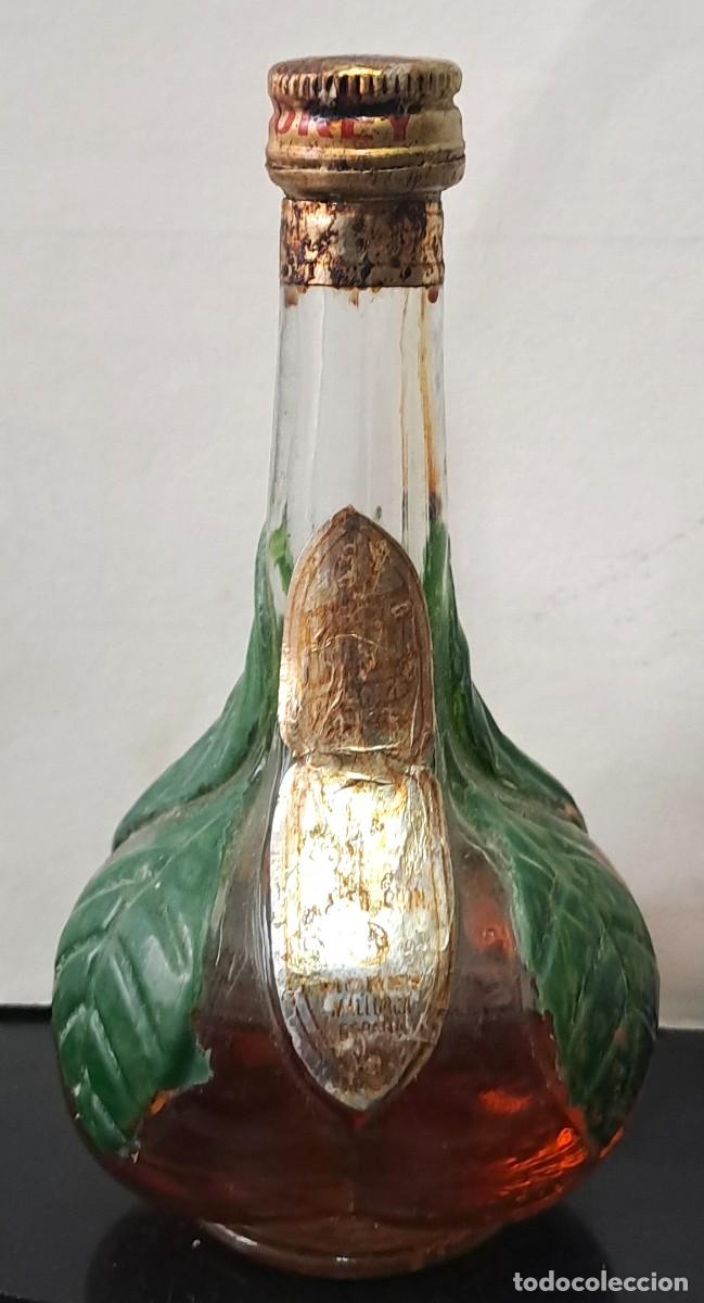 Coleccionismo de vinos y licores: BOTELLIN LICOR DE NARANJA. PECINTADO PERO FALTA DE LIQUIDO POR EVAPORACION. RF-6623