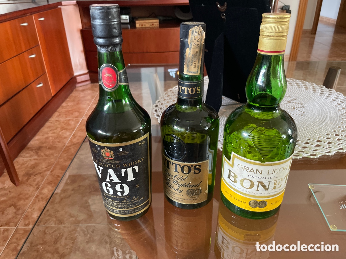 Coleccionismo de vinos y licores: Lote de tres botellas precintadas