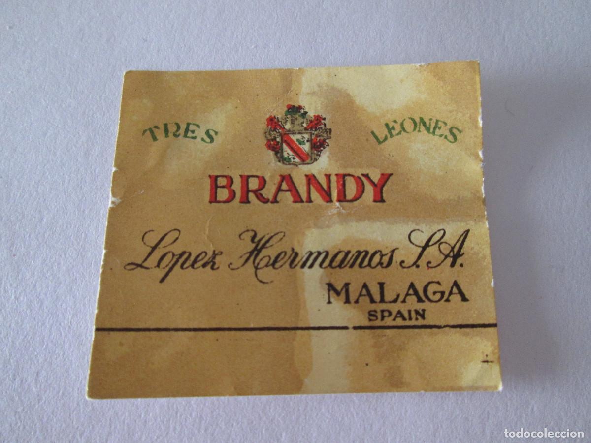 Coleccionismo de vinos y licores: ETIQUETA MINIATURA - TRE LEONES BRANDY - LOPEZ HERMANOS MALAGA - 4X4,5CM - SIN USAR