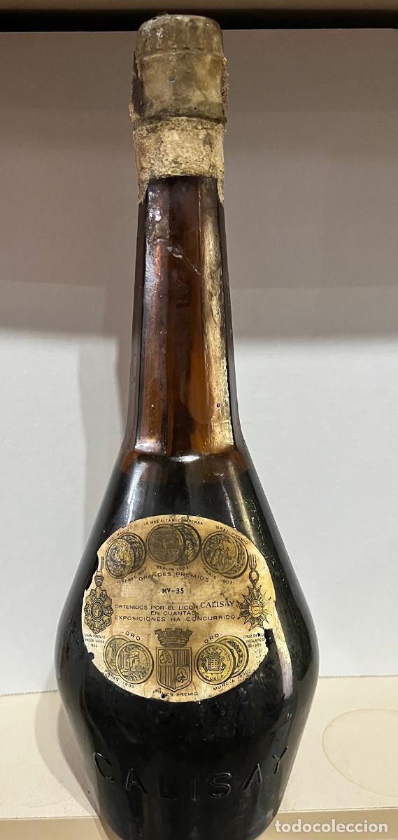 Coleccionismo de vinos y licores: Botella licor hierbas Calisay. Vidrio &aacute;mbar, etiqueta original sello cuello. Finales 60' Inicios 70'