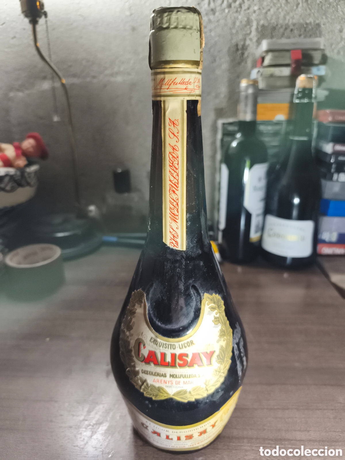 Coleccionismo de vinos y licores: Antigua botella de licor Calisay completamente llena preci ta 4 ptas grande 75 cl