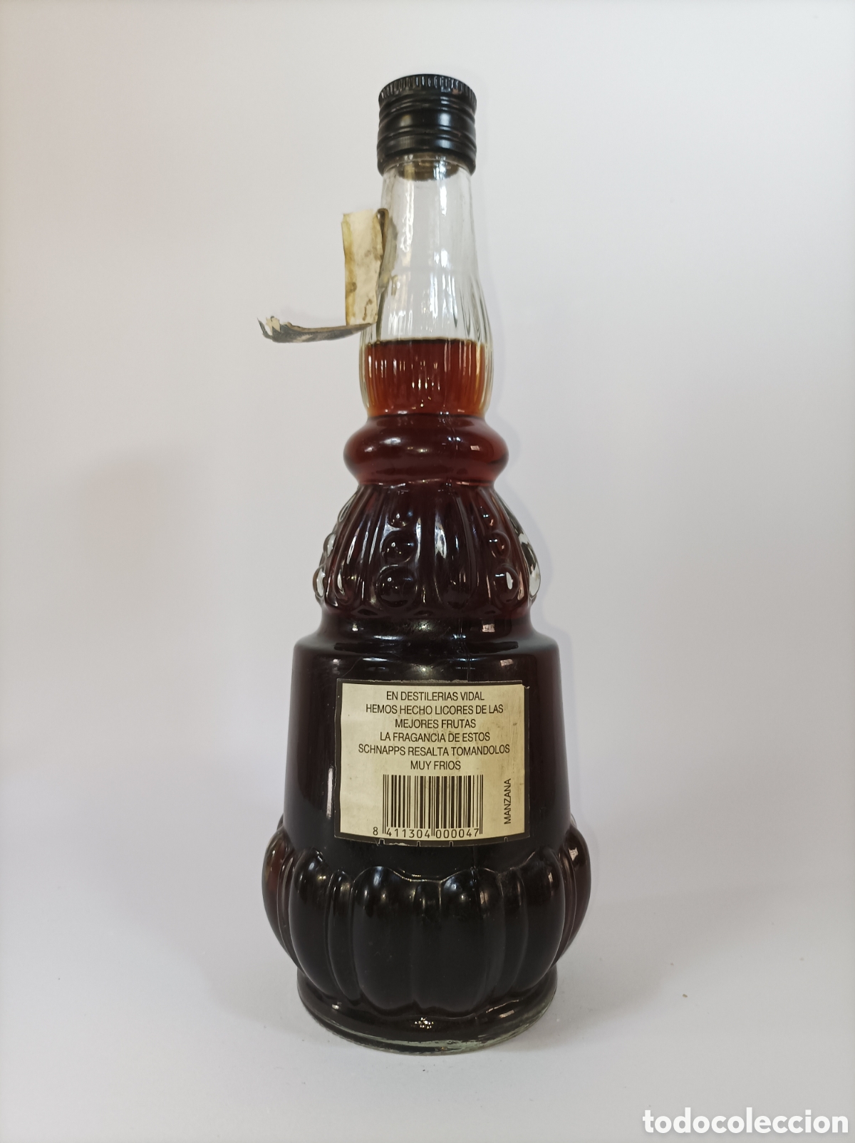 Coleccionismo de vinos y licores: LICOR DE MANZANA. DESTILER&Iacute;AS VIDAL. FALTA ETIQUETA DELANTERA. BONITA BOTELLA ANTIGUA.