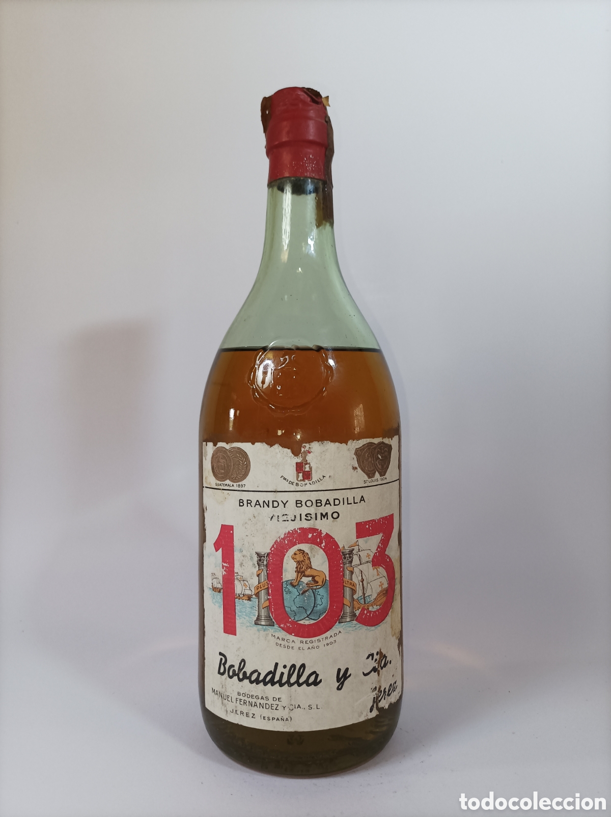Coleccionismo de vinos y licores: BRANDY 103 VIEJ&Iacute;SIMO. BOBADILLA. 1 LITRO. BOTELLA LICOR ANTIGUA.
