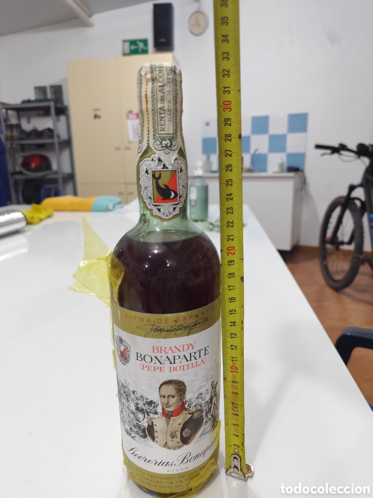 Coleccionismo de vinos y licores: BRANDY BONAPARTE &ldquo;PEPE BOTELLA&rdquo; &ndash; COSECHA 1900 &ndash; 1 L APROX. &ndash; DOBLE PRECINTO 40 CTS &ndash; ANTIGUO