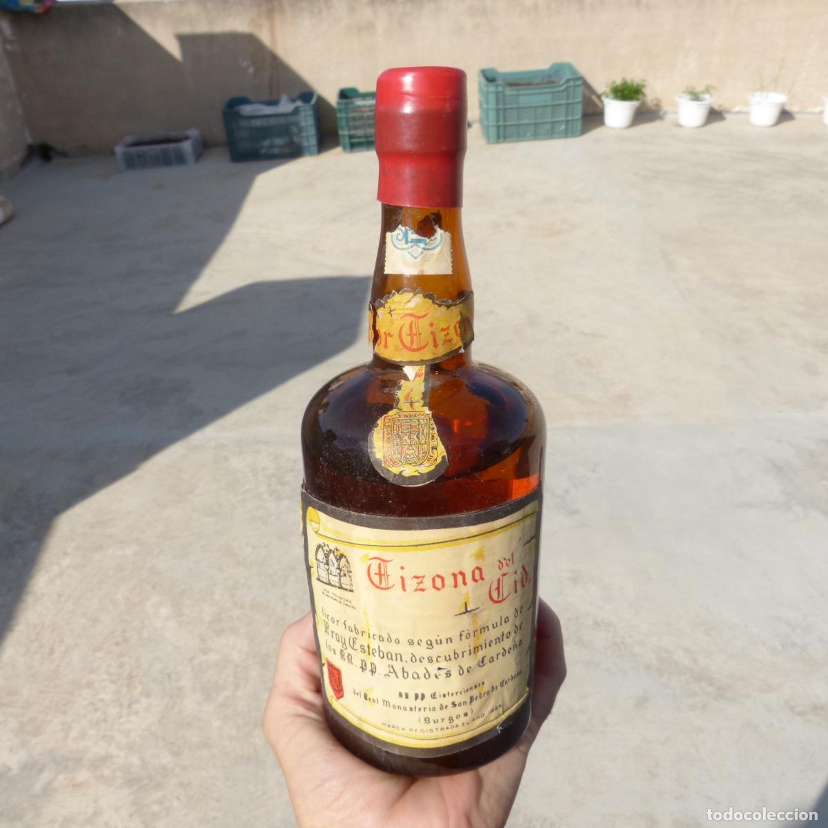 Coleccionismo de vinos y licores: Antigua botella de licor, Tizona del cid , Burgos , litro, monasterio s pedro carde&ntilde;a, 1285gr, 25cm