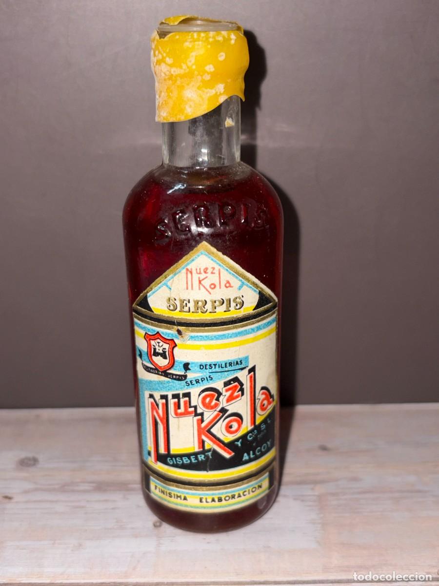 Coleccionismo de vinos y licores: BOTELL&Iacute;N. NUEZ KOLA. SERPIS.