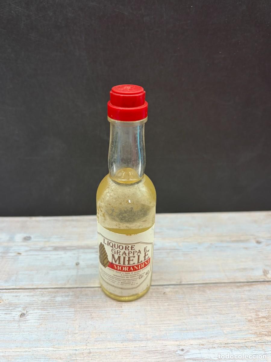 Collection of wines and liquors: BOTELL&Iacute;N. LIQUORE GRAPA E MIELE. MORANDINI