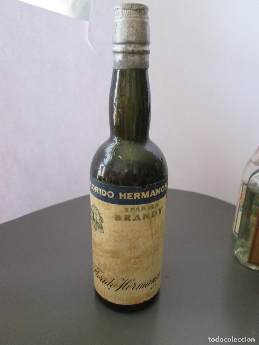 Coleccionismo de vinos y licores: BOTELLIN MINIATURA LICOR - BRANDY FLORIDO HERMANOS - CASI LLENA