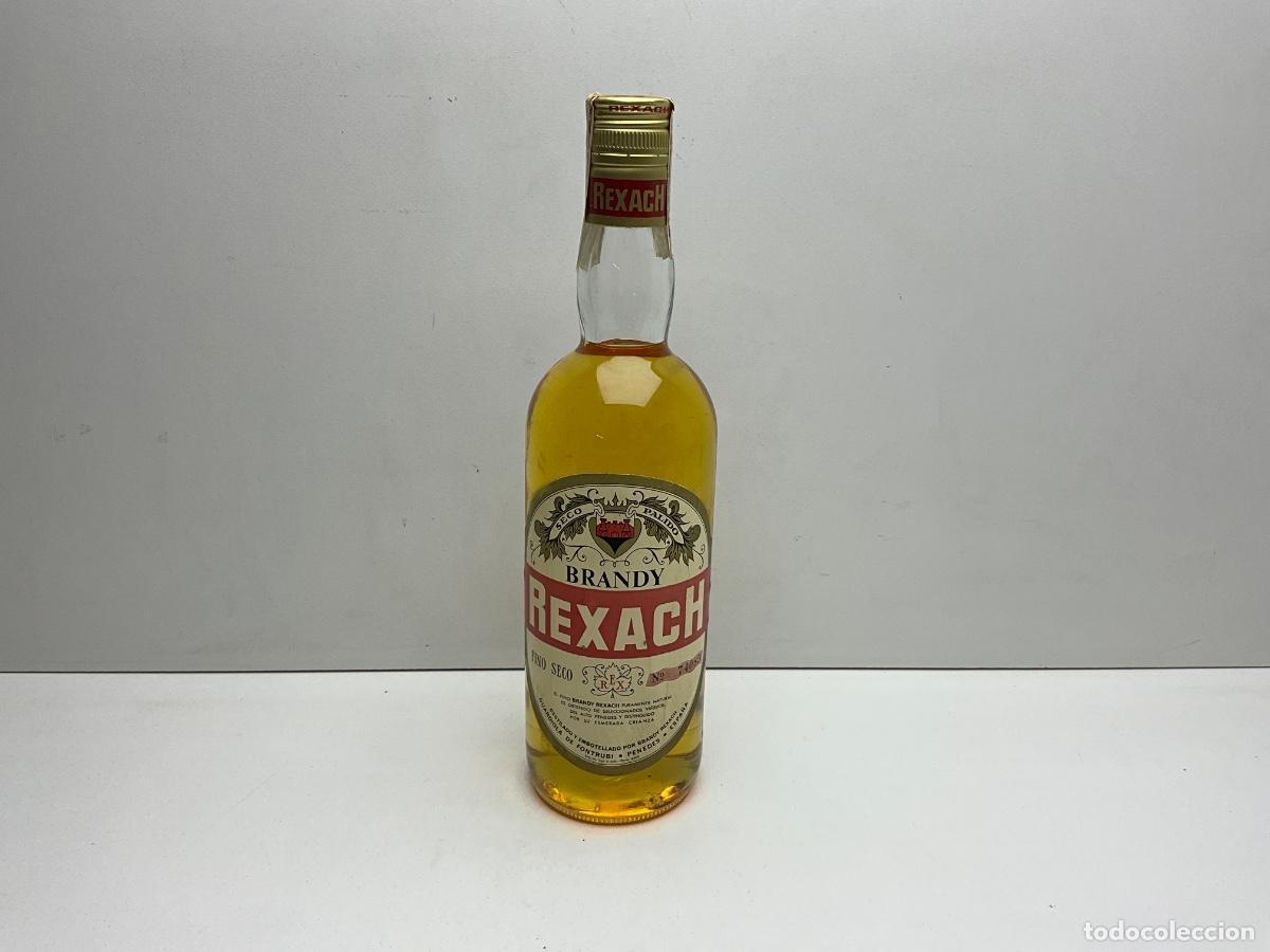 Coleccionismo de vinos y licores: RARA Y DIF&Iacute;CIL BOTELLA DE BRANDY REXACH - VILAFRANCA DEL PENEDES - 29 CM ALTURA