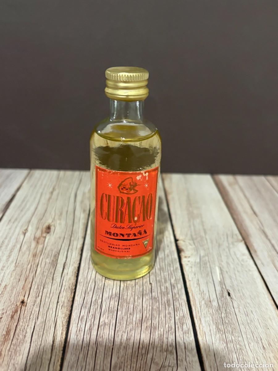 Coleccionismo de vinos y licores: BOTELLA DE LICOR CURA&Ccedil;AO DULCE SUPERIOR MONTA&Ntilde;A. DESTILER&Iacute;AS MONTA&Ntilde;A. GRANOLLERS, BARCELONA.