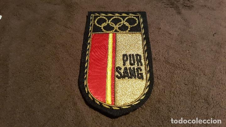 Sammeln: PARCHE ESCUDO HERALDICO BORDADO CON EMBLEMA DE OLIMPIADAS Y SIGLAS PUR SANG