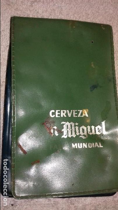 Coleccionismo: antigua tarjetera cerveza san miguel .esta como.se ve en la foto.da&ntilde;ada