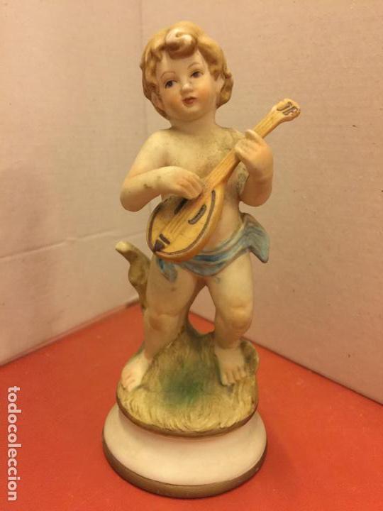 Coleccionismo: precioso angel o querubin en porcelana mate. Mide aprox 14cms de largo Bonita expresion