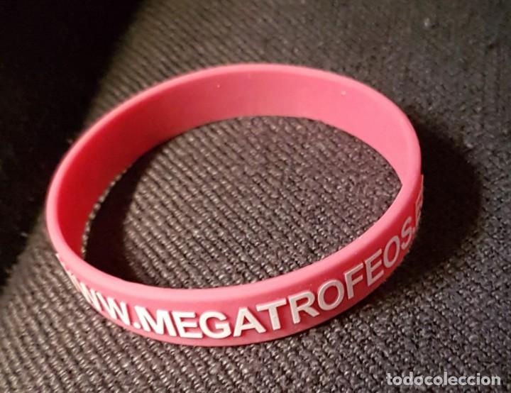 Coleccionismo: Pulsera de goma con publicidad - Foto 1