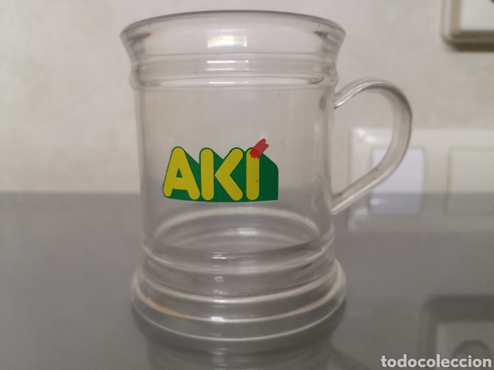 Coleccionismo: ANTIGUA TAZA PVC PUBLICIDAD AK&Iacute;