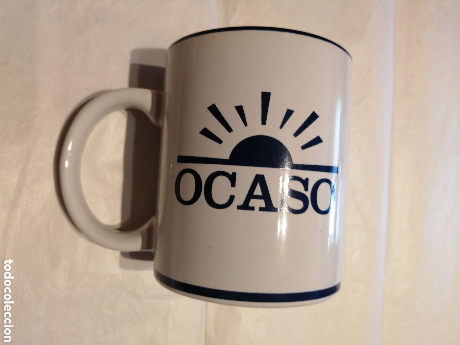 Coleccionismo: Ocaso. Taza de porcelana de seguros con publicidad.