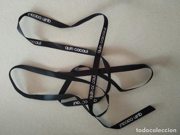 Coleccionismo: CINTA TIPO PARA HACER LAZO DONDE PONE QUIN CACAU! DE COLOR NEGRO Y LETRAS BLANCAS.