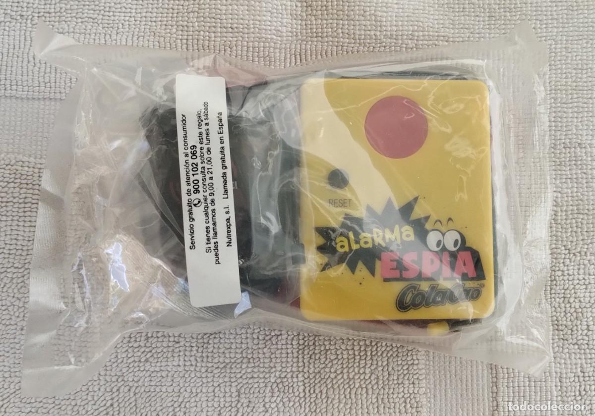 Coleccionismo: ALARMA ESP&Iacute;A DE COLA CAO. NUEVA SIN ABRIR