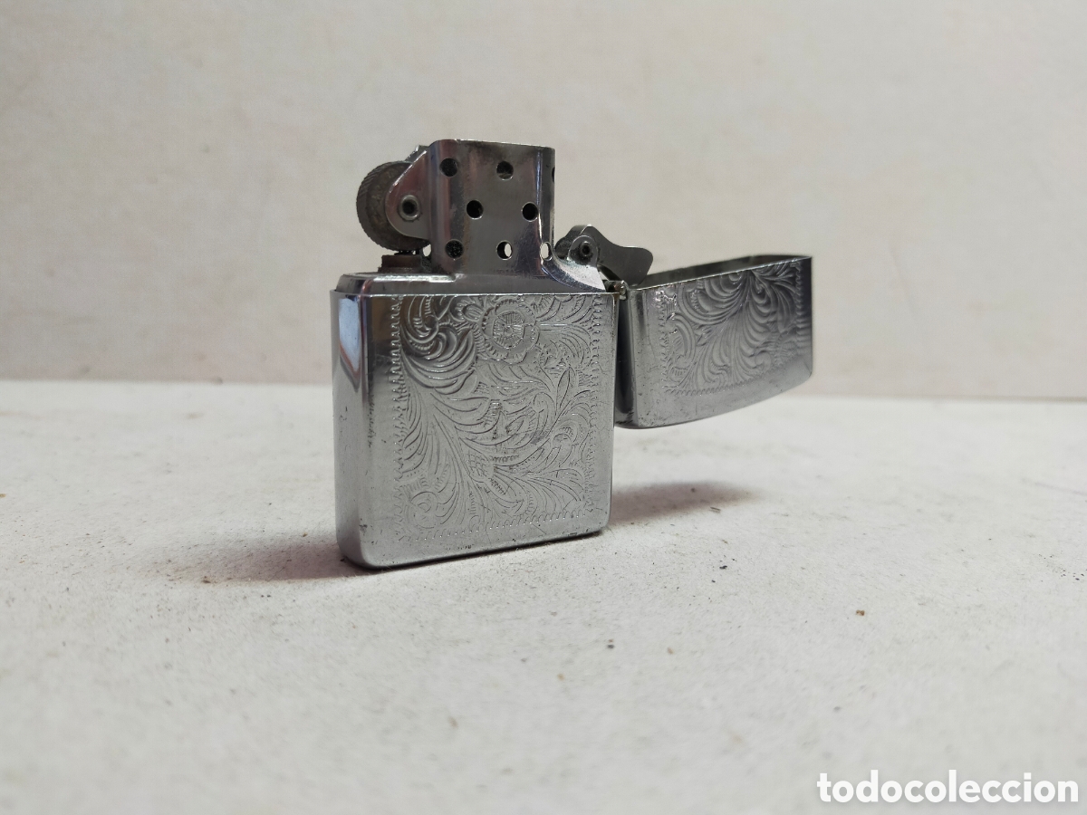 Coleccionismo: MECHERO ZIPPO. BRADFORD PA.ADE IN USA. DECOR VEGETAL GRABADA.