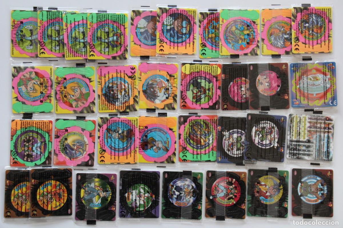 Coleccionismo: MATUTANO BEYBLADE SPINNERS TAZOS LOTE 34 PRECINTADOS