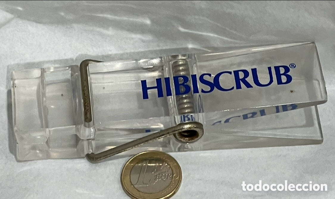 Sammeln: Pinza sujetapapeles. Publicidad HIBISCRUB. Metacrilato y metal. A&ntilde;os 80.