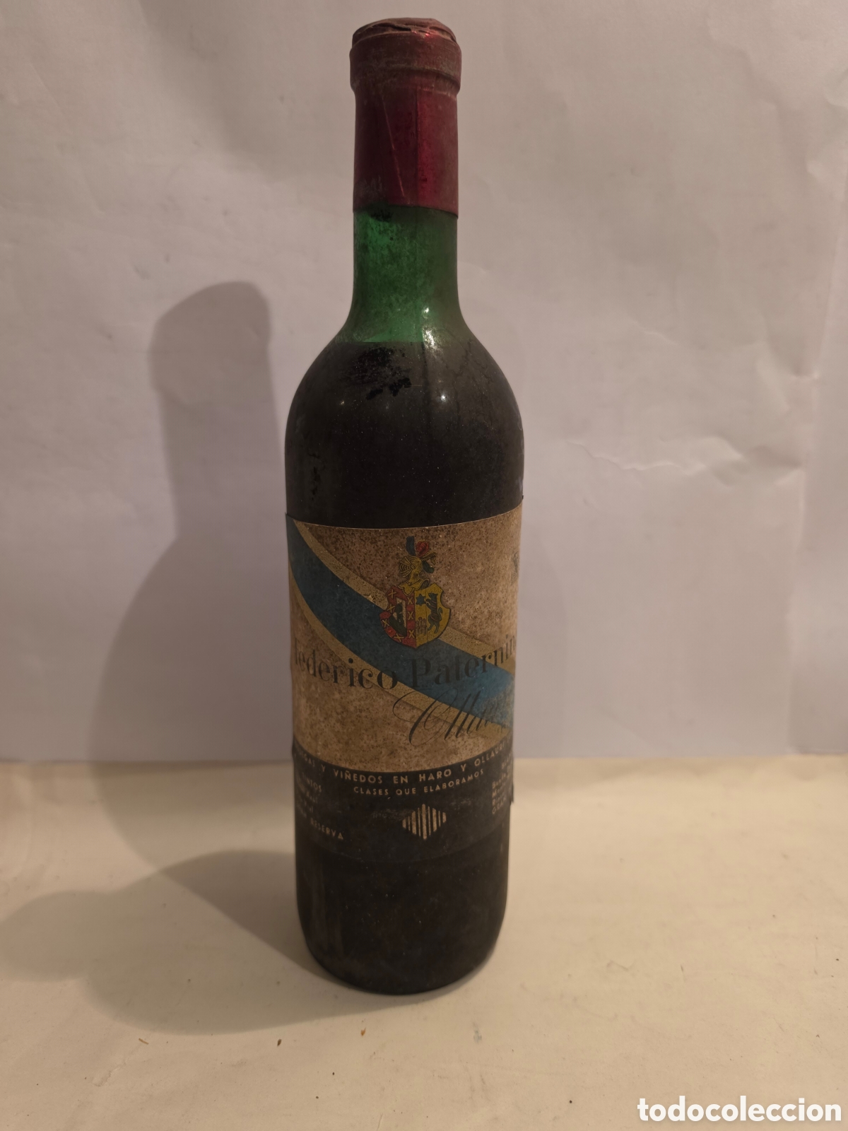 Coleccionismo: ANTIGUA BOTELLA DE VINO. PATERNINA BANDA AZUL. HARO. OLLAURI. A&Ntilde;OS 50, 60?