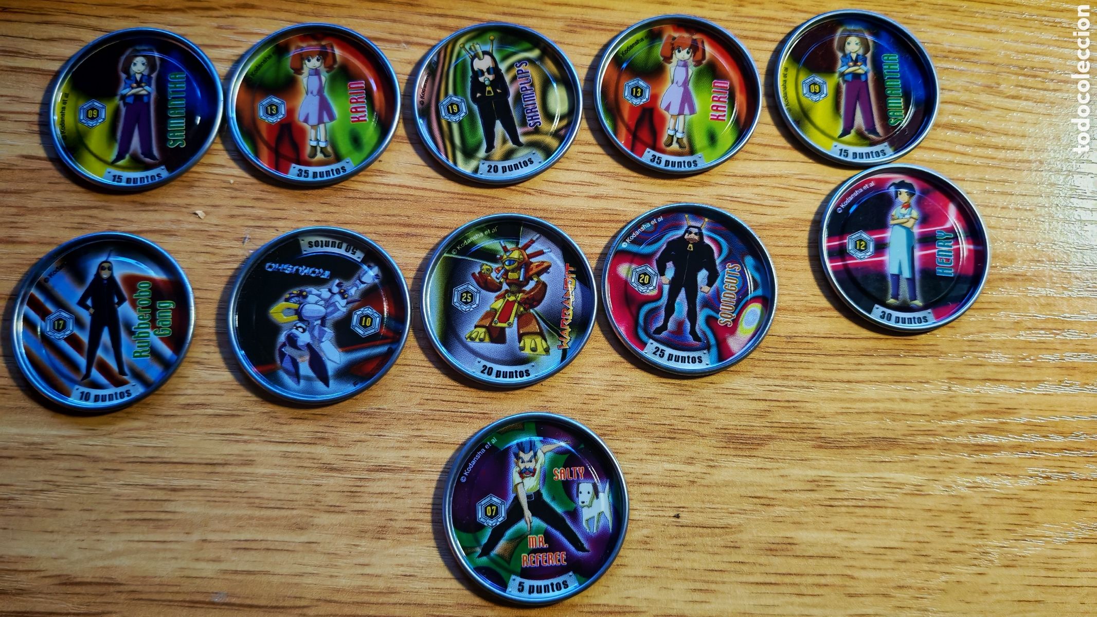 Coleccionismo: 11 Tazos metalicos coleccion Medabots Metal Rappers.Ma&ntilde;anitos. Panrico Bollicao. 1997