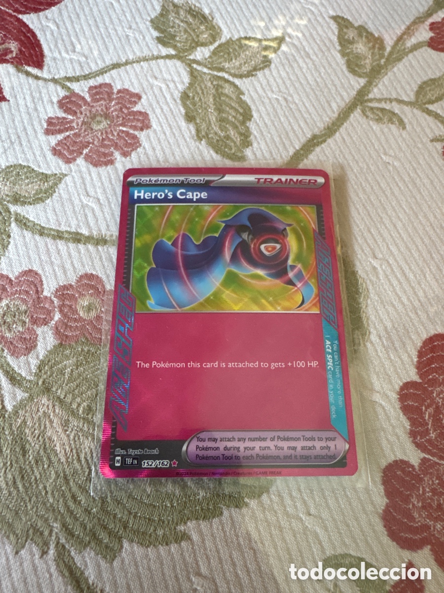 Sammeln: Hero&rsquo;s Cape Pokemon card holo