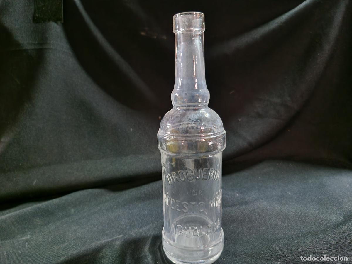 Coleccionismo: BONITA BOTELLA COLECCIONABLE DE CRISTAL. DROGERIA DE MABESTO MORTIL IGUALADA. 15CM A