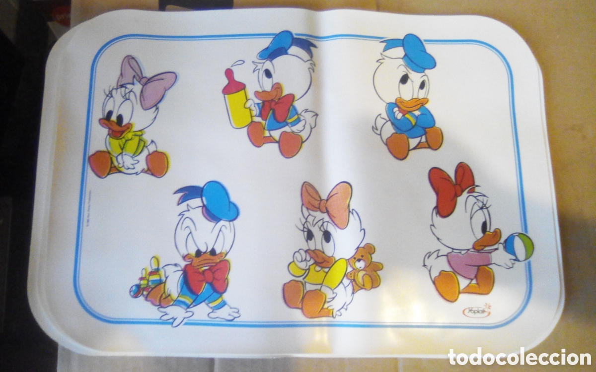 Coleccionismo: Donald y Daisy de ni&ntilde;os. Salvamanteles Disney - Yoplait. &copy; 1985. Mide 38,5 x 27 cm., pl&aacute;stico.