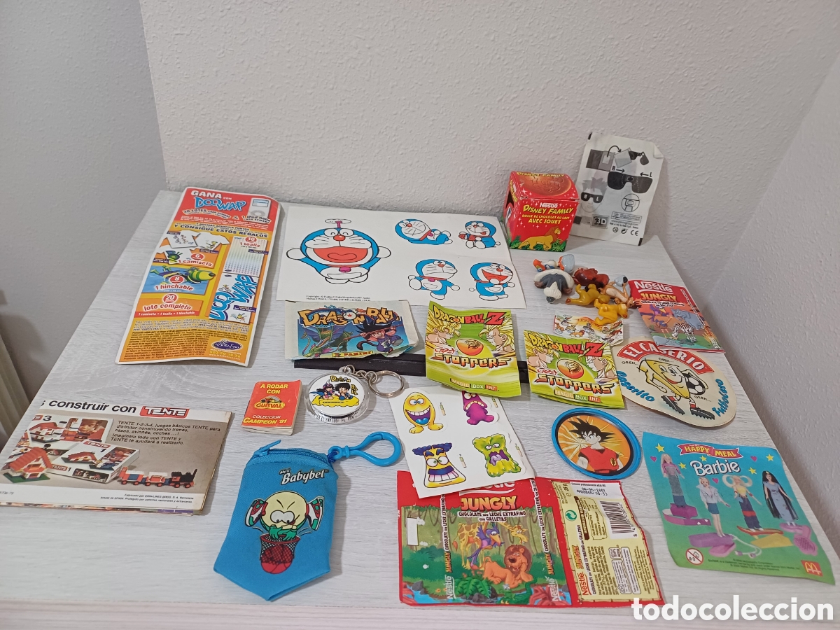Coleccionismo: LOTE ENVOLTORIOS COMESTIBLES, MANUALES JUGUETES, DRAGON BALL, BARBIE, TENTE, GUISVAL Y VARIOS