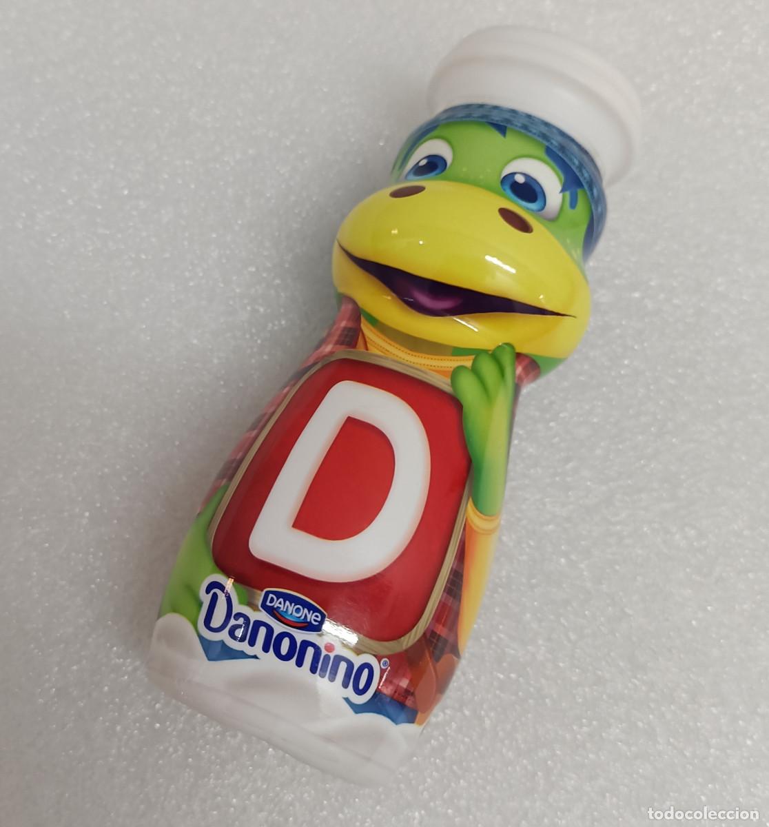 Coleccionismo: botella danonino mascota danone promocional publicitaria dinosaurio dino abecedario