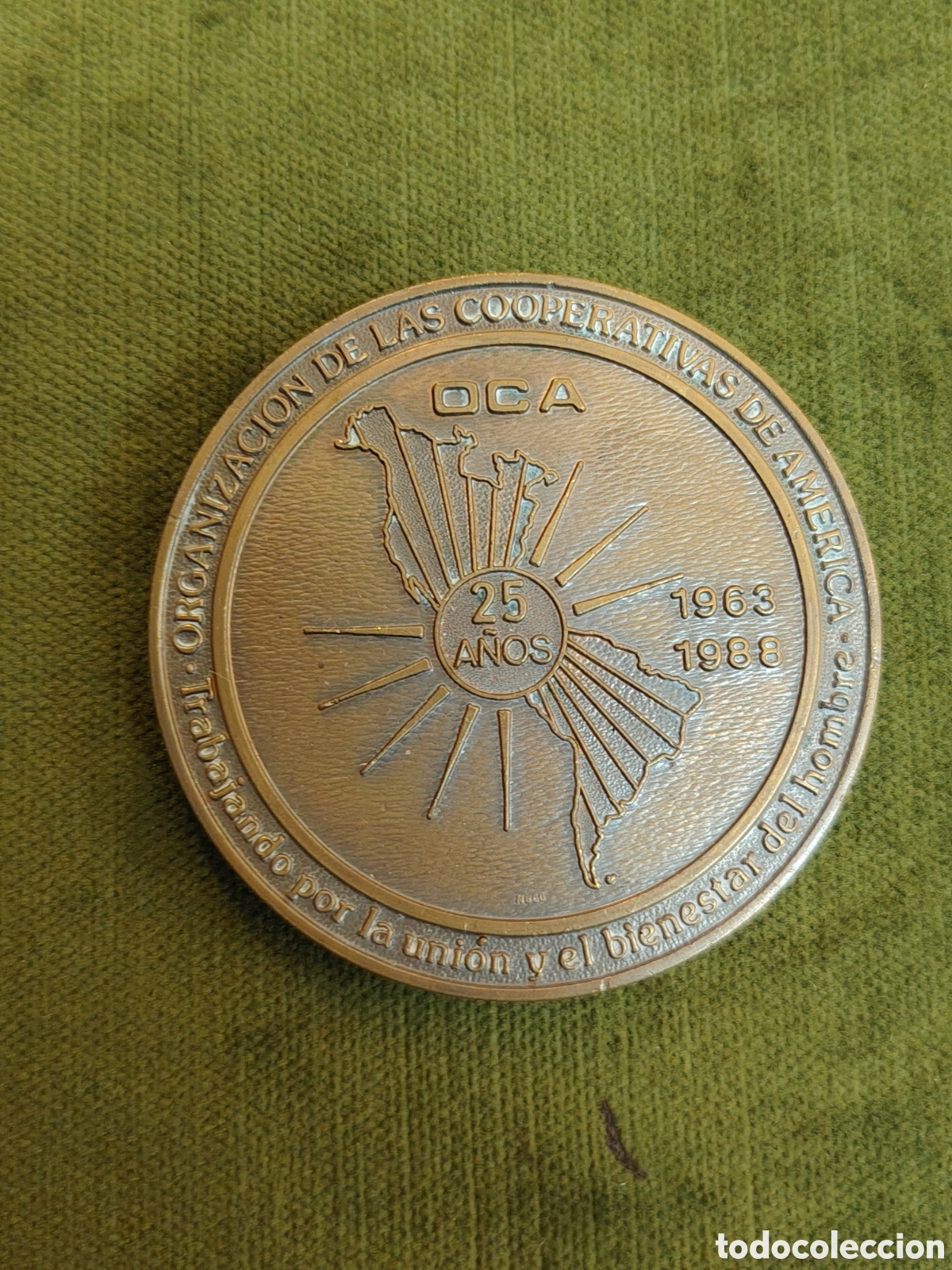 Sammeln: Medalla conmemorativa del 25 aniversario (1963-1988) de la Organizaci&oacute;n de las Cooperativas de Am&eacute;ri