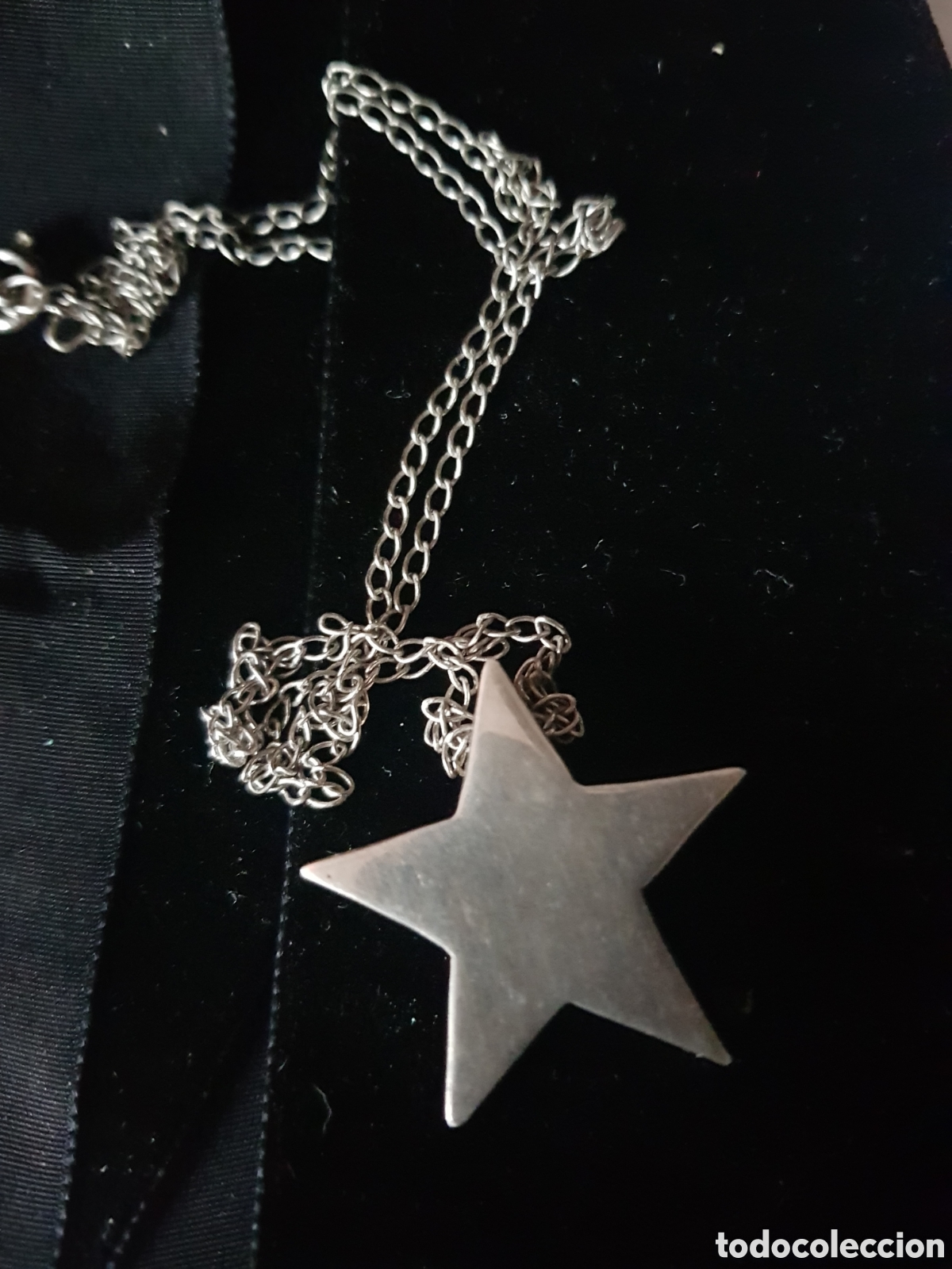 Coleccionismo: COLGANTE DE UNA ESTRELLA DE PLATA