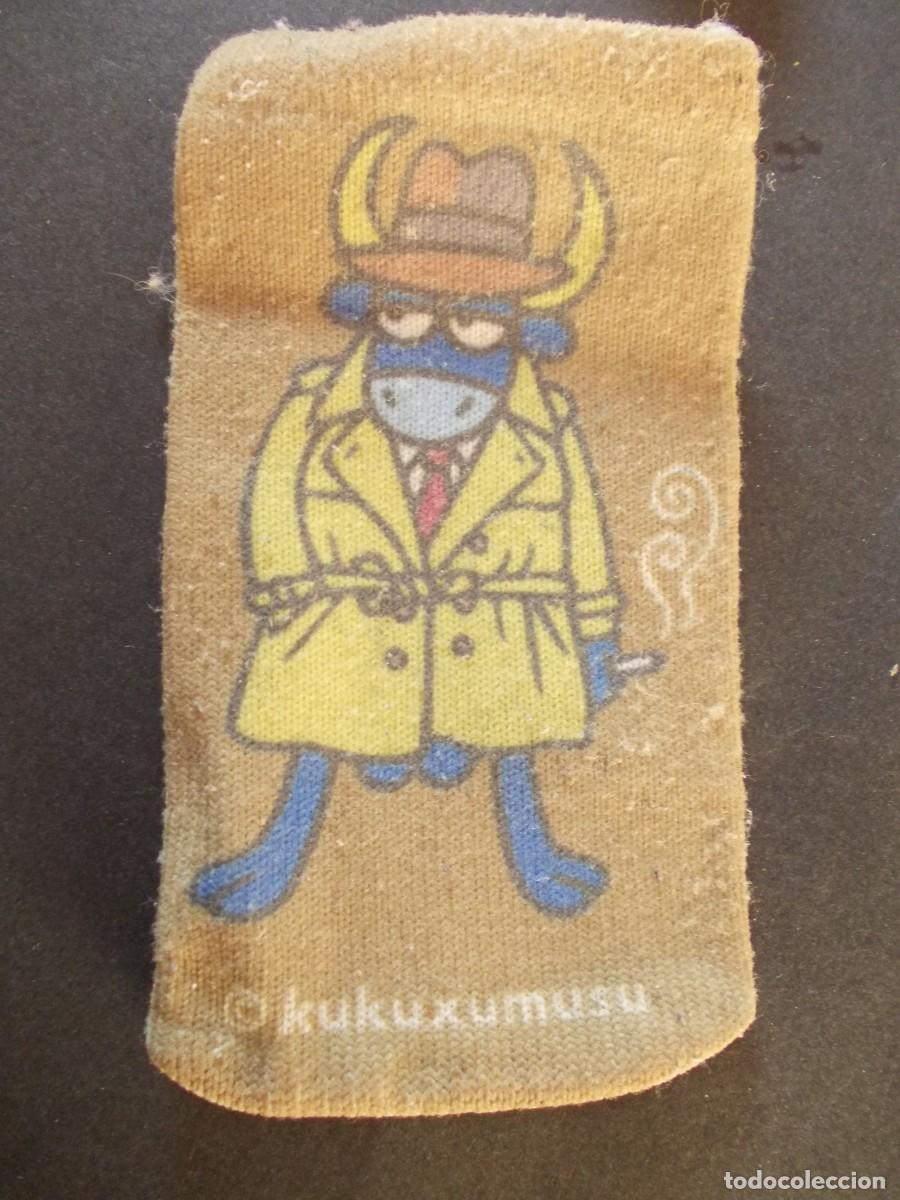 Collezionismo: Funda Kukuxumusu telefono movil calcetin textil toro detective gabardina tela publicidad retro compa