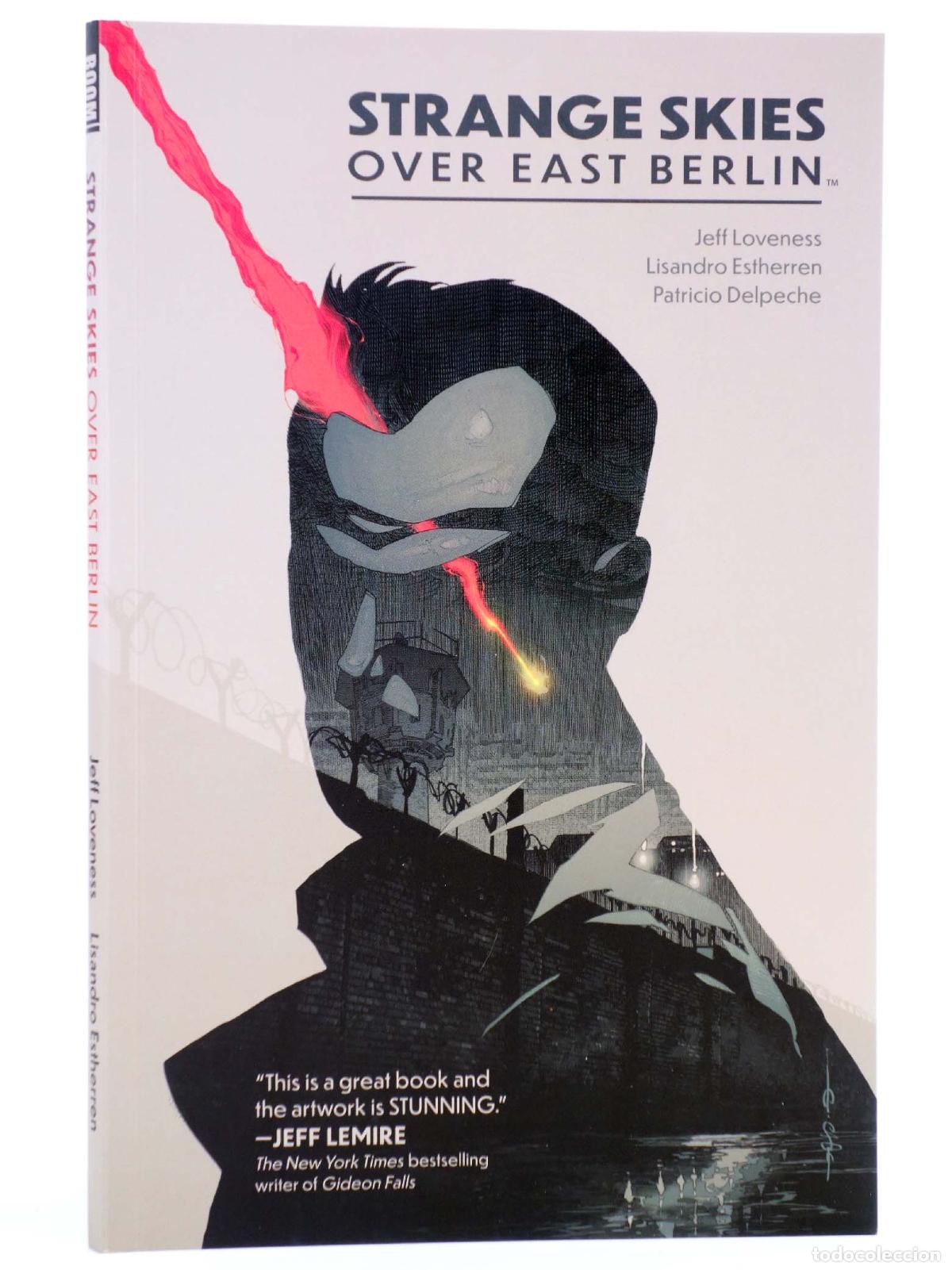 Comics : STRANGE SKIES OVER EAST BERLIN TPB (Loveness / Estherren) BOOM, 2020. EN INGL&Eacute;S. OFRT antes 14,99E