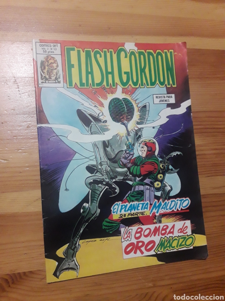 C&oacute;mics: FLASH GORDON -V.2- 13 &middot; EL PLANETA MALDITO (2&ordf; PARTE) / LA BOMBA DE ORO MACIZO - Foto 1
