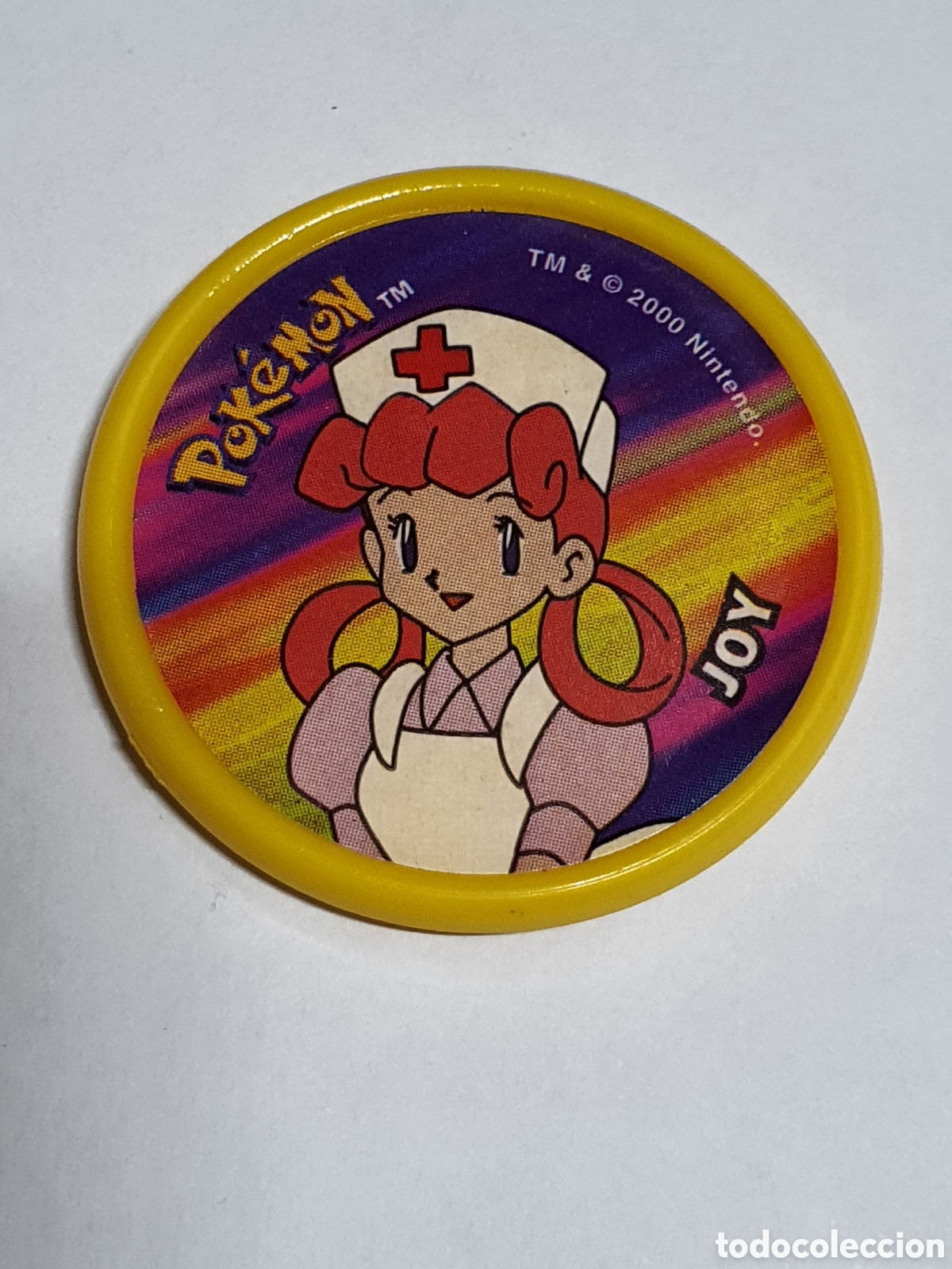 Coleccionismo cromos antiguos: Pokemon m&aacute;ster tazo amarillo, enfermera Joy, matutano Nintendo