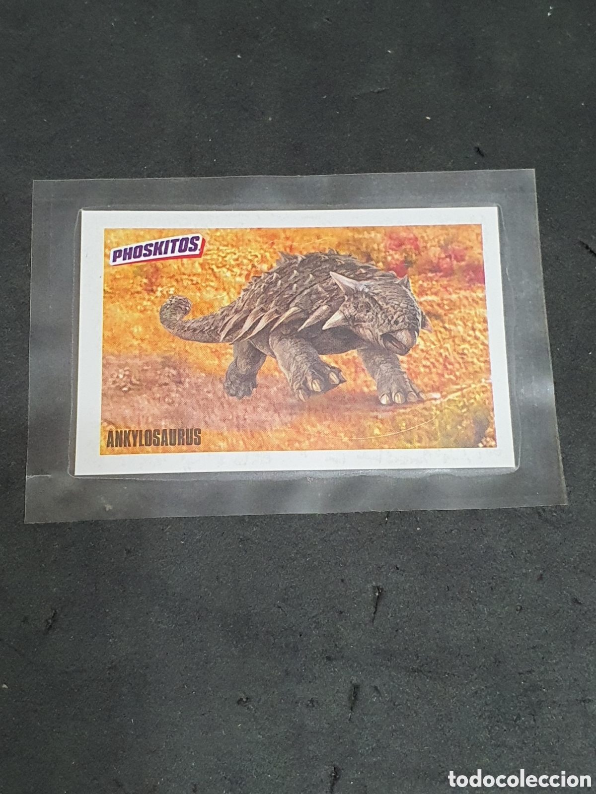 Coleccionismo Cromos antiguos: Phoskitos Jurassic World Ankylosaurus nuevo y precintado