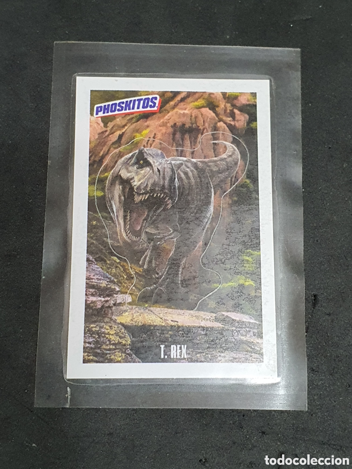Coleccionismo Cromos antiguos: Phoskitos Jurassic World T.Rex nuevo y precintado