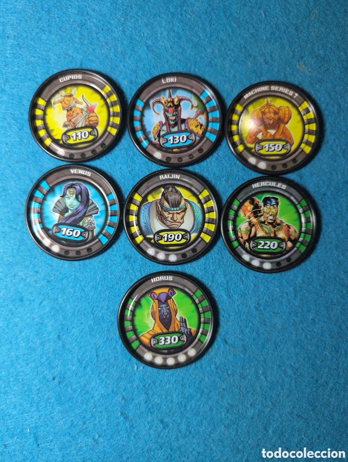 Coleccionismo Cromos antiguos: SLINGERS WAR TITANS MEDALLON tazos