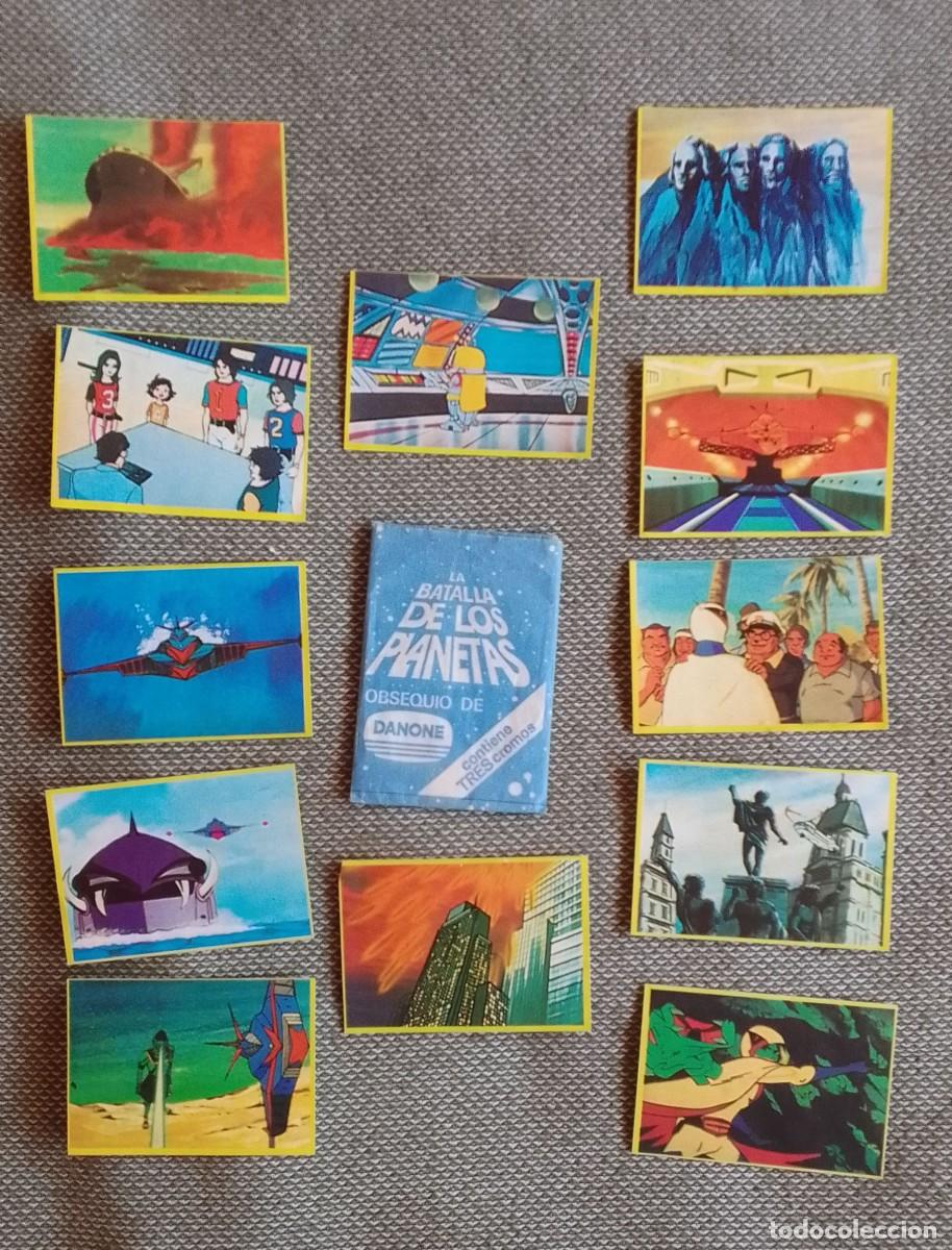 Coleccionismo Cromos antiguos: LOTE DE SOBRE VACIO Y 12 CROMOS LA BATALLA DE LOS PLANETAS. DANONE.
