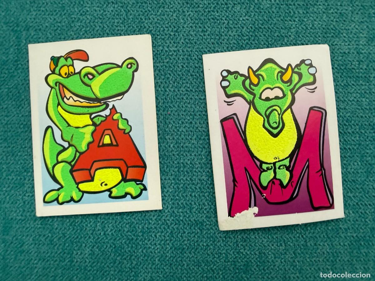Coleccionismo cromos antiguos: 2 cromos galletas LU - Dinosaurios - Dinoletras letras