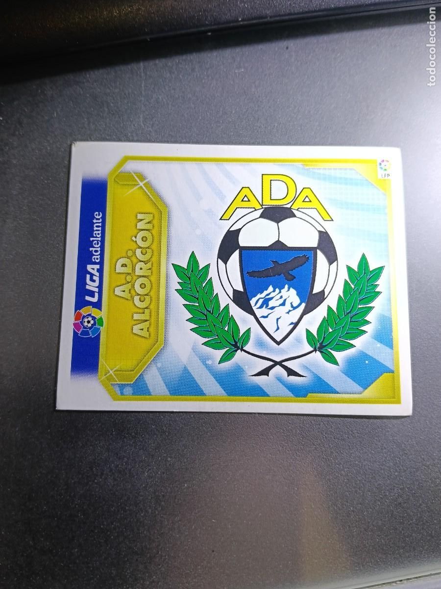 Coleccionismo cromos antiguos: CROMO ESCUDO ALCORCON 2&ordf; SEGUNDA DIVISION LIGA ADELANTE 11 12 2011 2012 ESTE PANINI NUNCA PEGADO