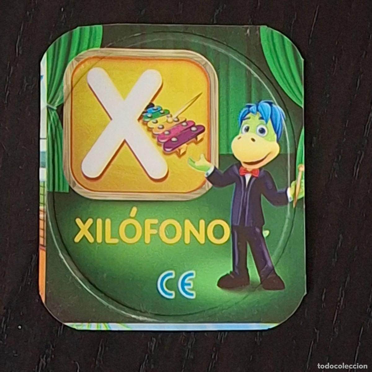 Coleccionismo cromos antiguos: DANONINO PETIT SUISSE TAPA YOGURT CROMO - ABECEDARIO - LETRA X XILOFON - DANONE